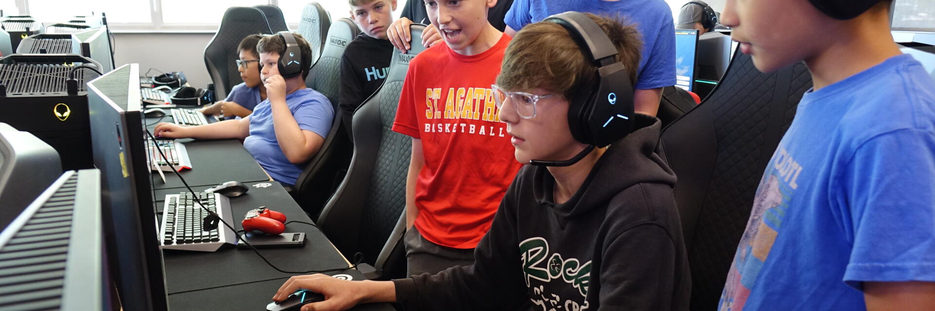 Kids playing computer game at summer camp